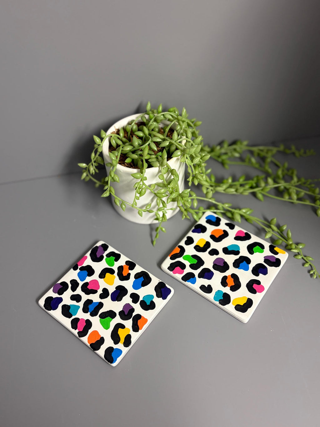 Bright rainbow leopard print hand painted ceramic coasters.