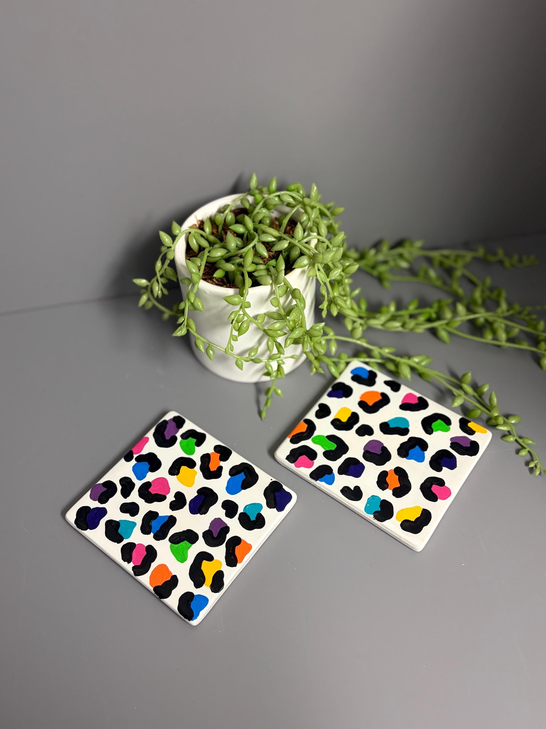 Bright rainbow leopard print hand painted ceramic coasters.