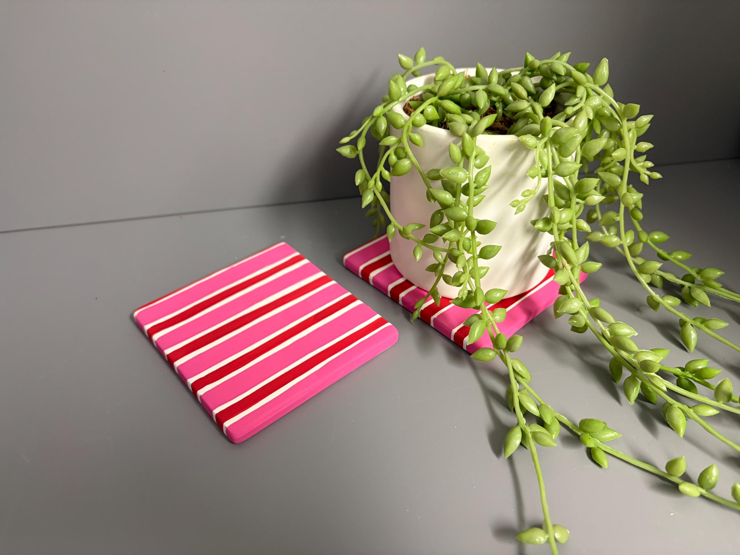 Pink and red stripe hand painted ceramic coasters.