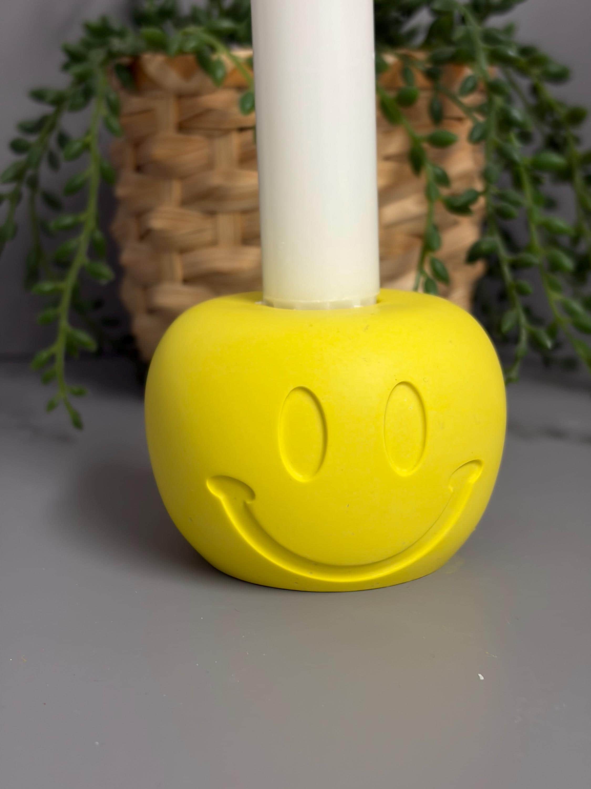 Handmade Jesmonite Smiley Face candle holder.