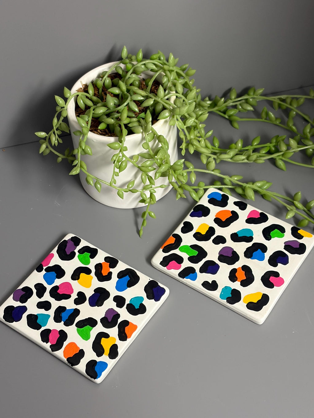 Bright rainbow leopard print hand painted ceramic coasters.