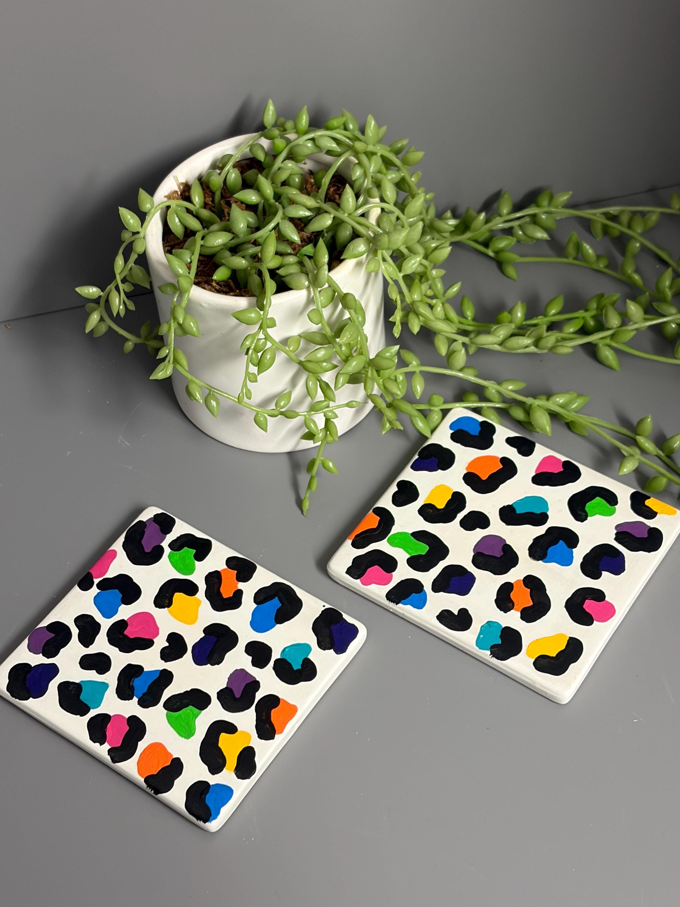 Bright rainbow leopard print hand painted ceramic coasters.