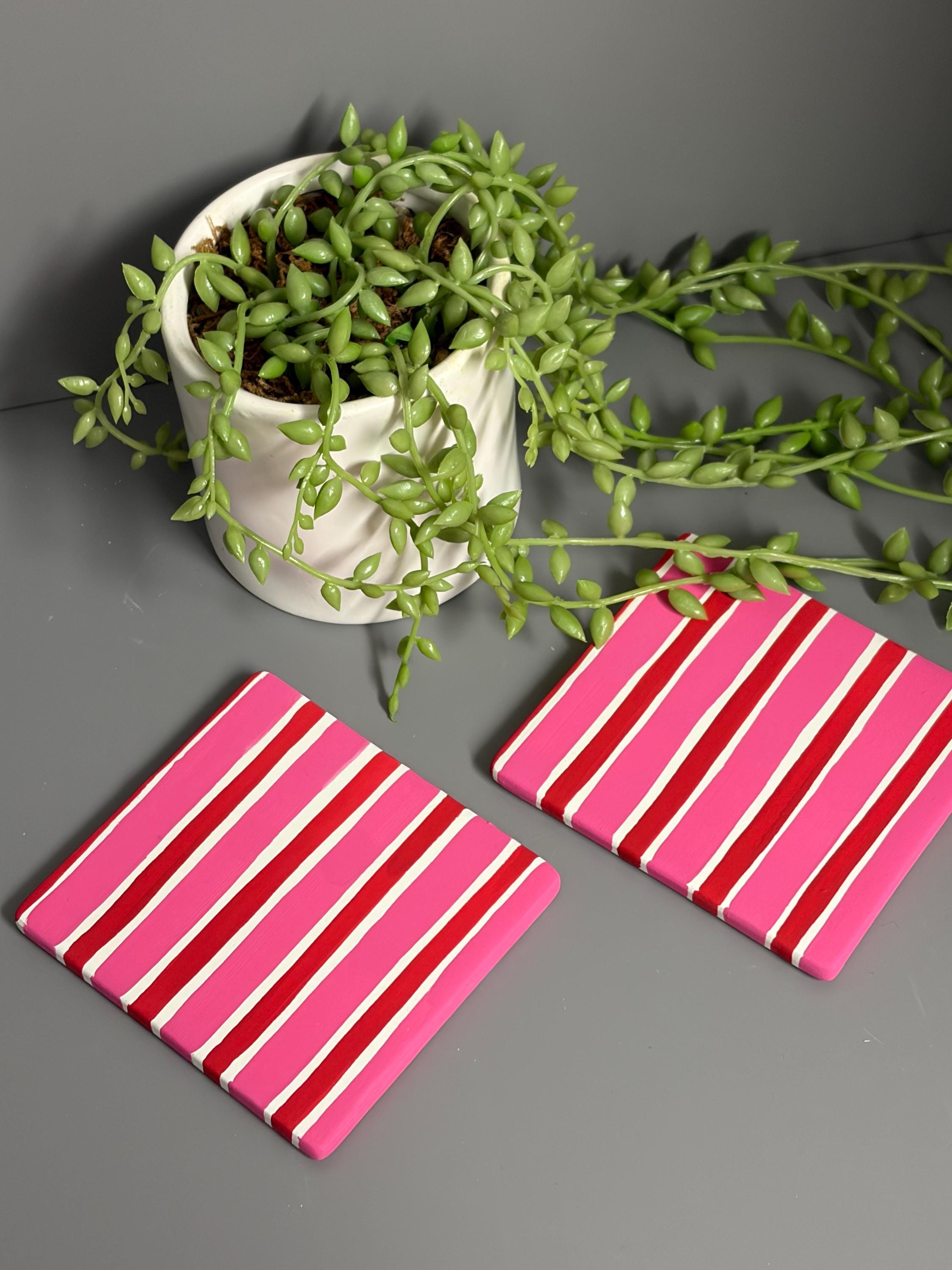 Pink and red stripe hand painted ceramic coasters.