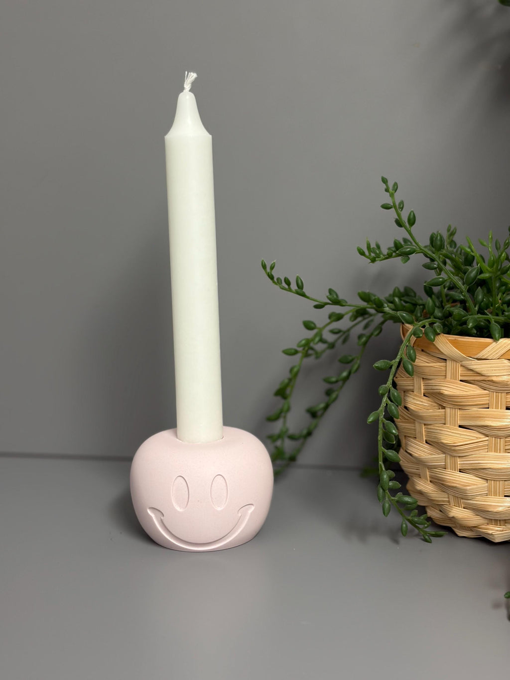 Handmade Jesmonite Smiley Face candle holder.
