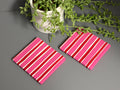 Pink and red stripe hand painted ceramic coasters.