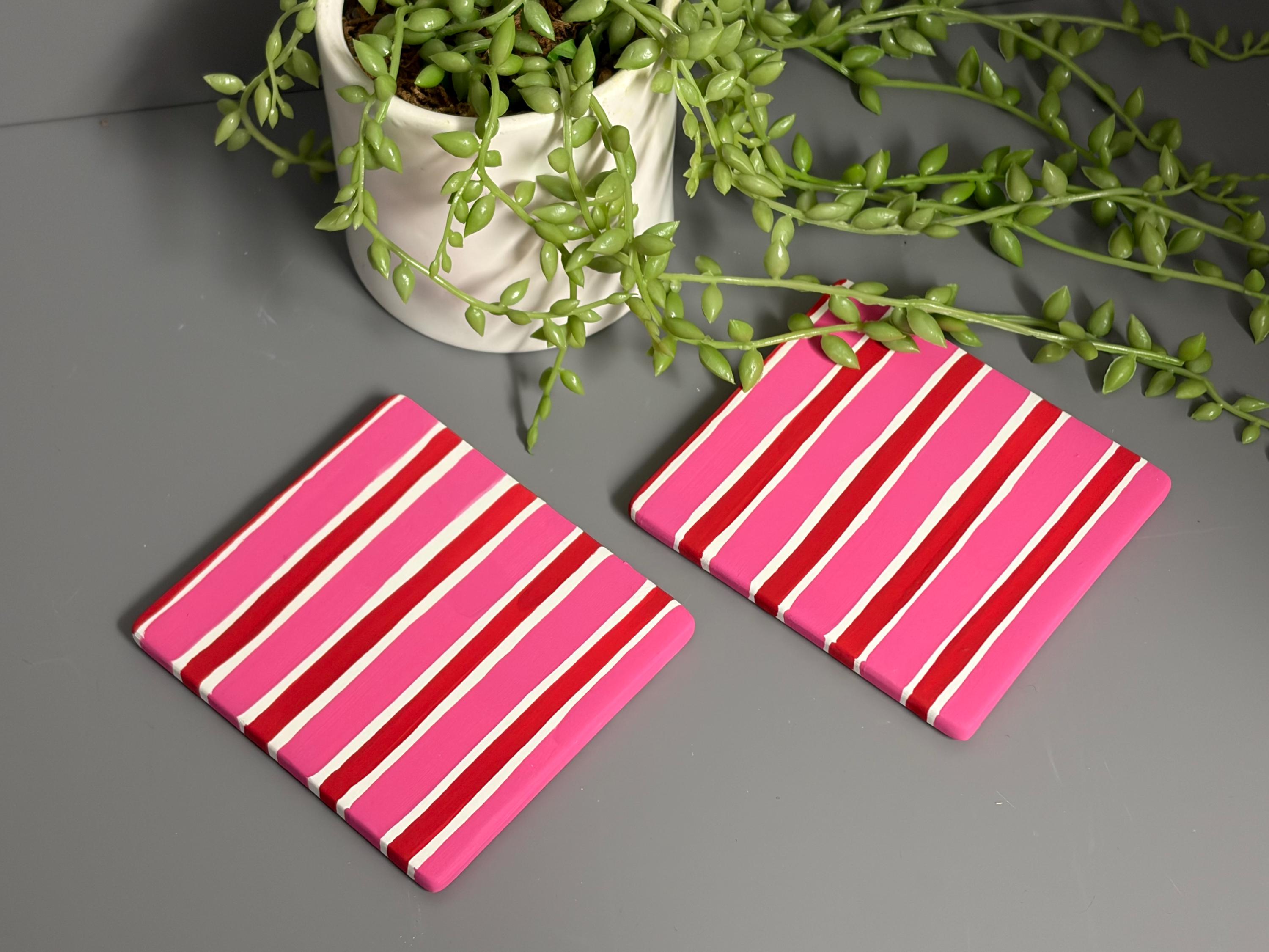 Pink and red stripe hand painted ceramic coasters.