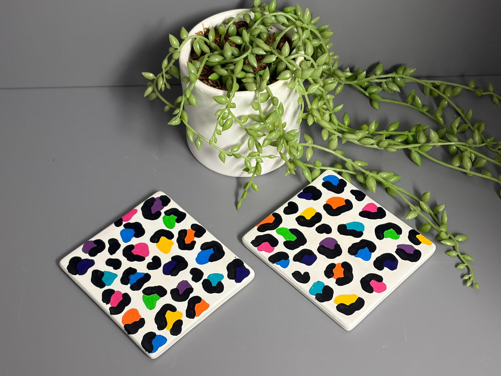 Bright rainbow leopard print hand painted ceramic coasters.