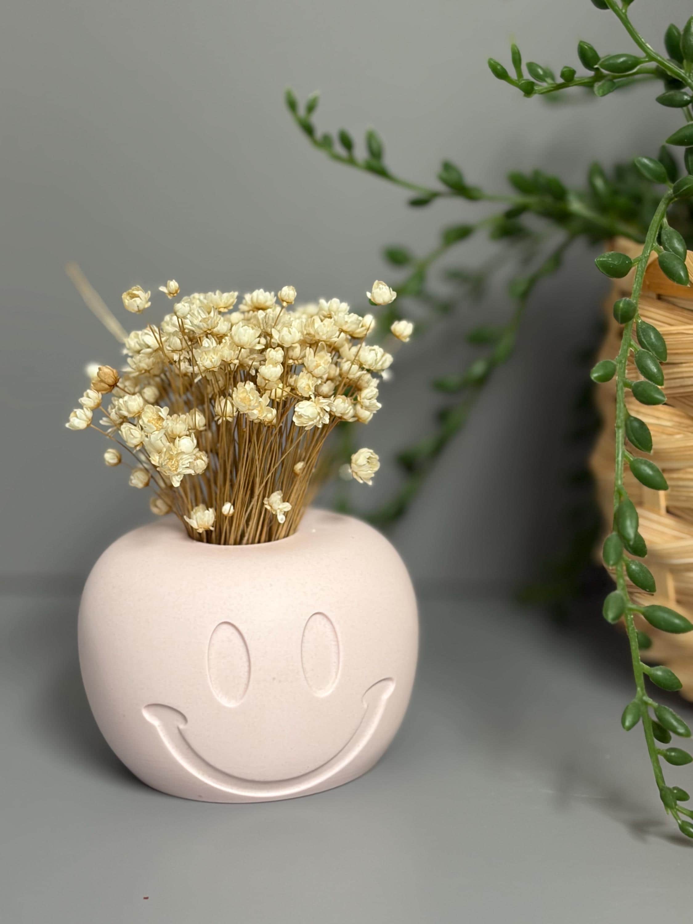 Handmade Jesmonite Smiley Face candle holder.