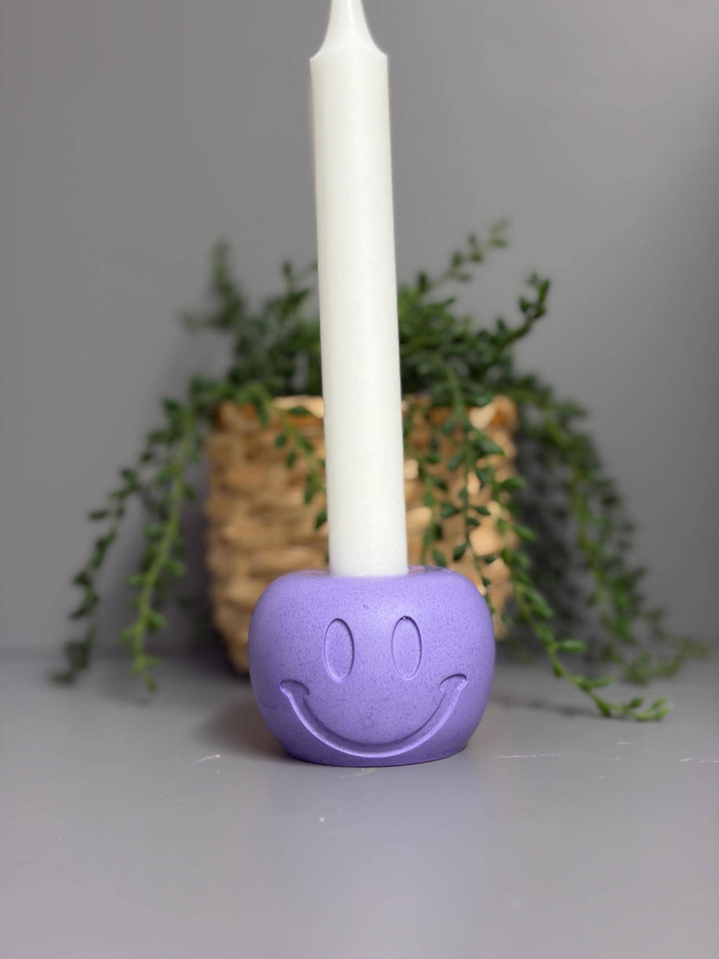 Handmade Jesmonite Smiley Face candle holder.