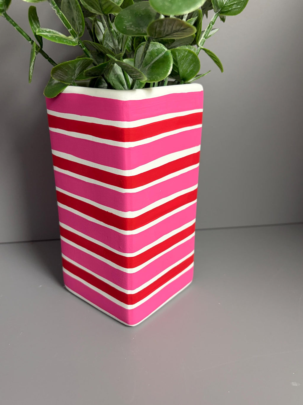 Pink and red stripe hand painted  ceramic vase.