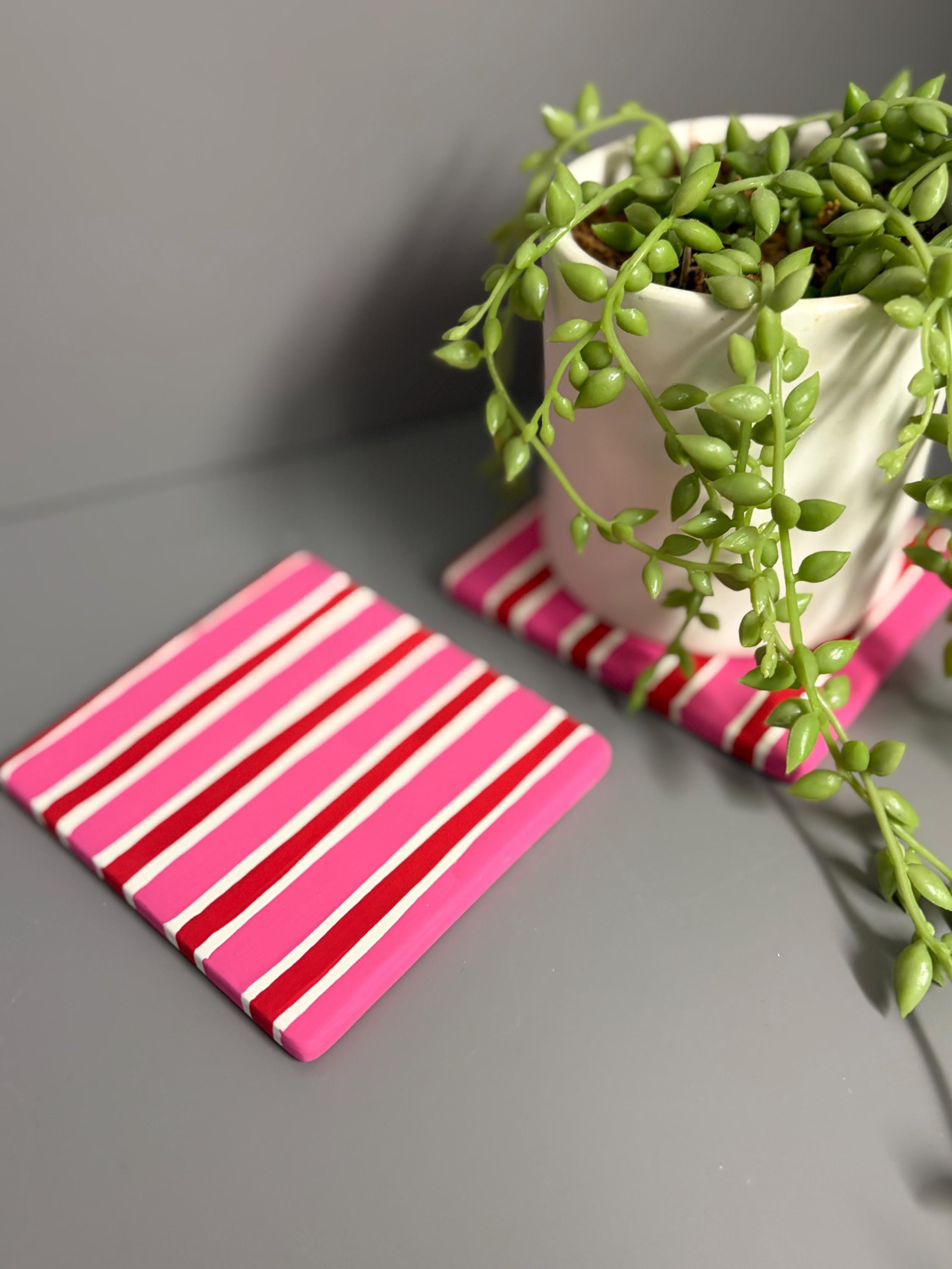 Pink and red stripe hand painted ceramic coasters.