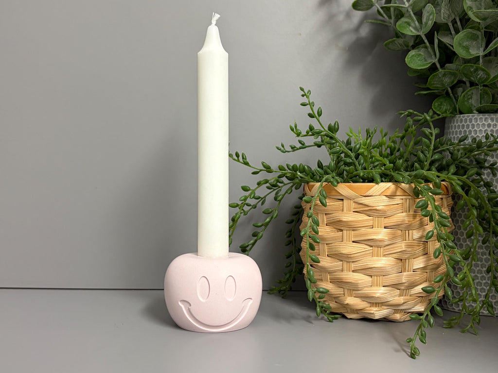 Handmade Jesmonite Smiley Face candle holder.