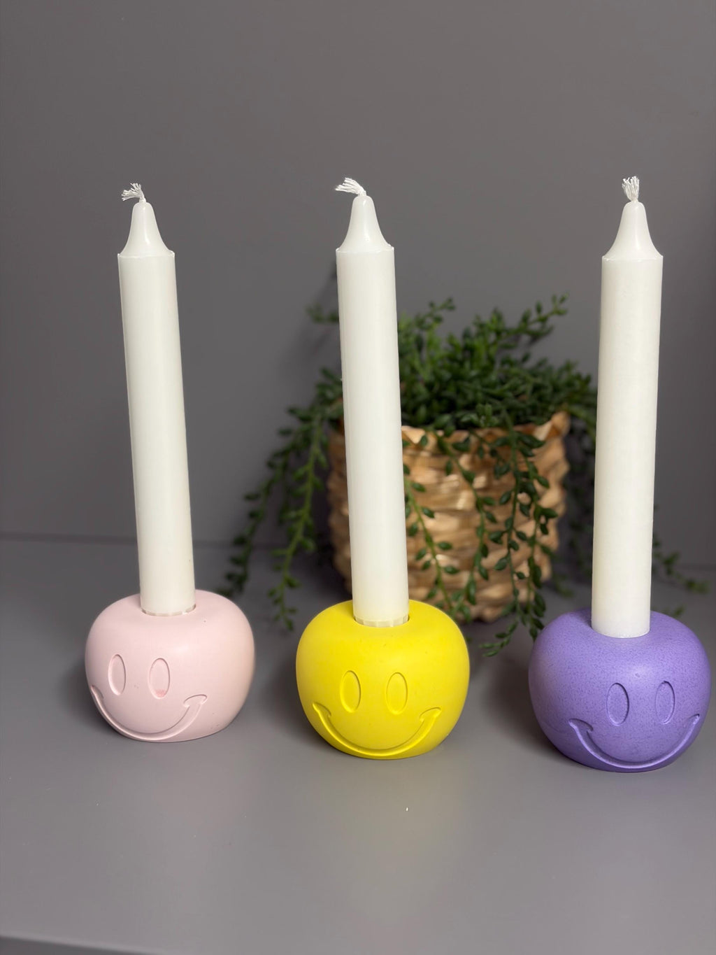 Handmade Jesmonite Smiley Face candle holder.