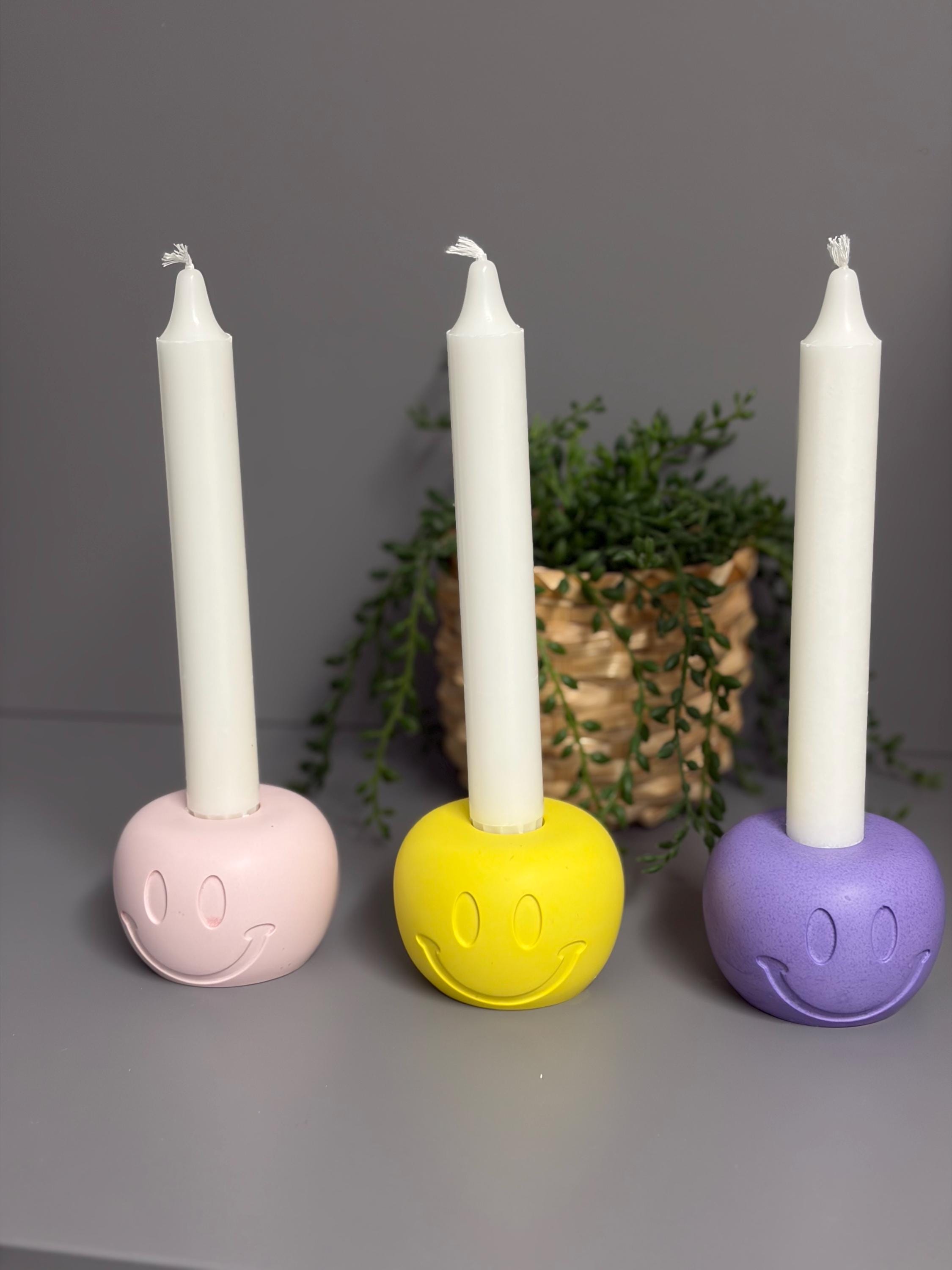 Handmade Jesmonite Smiley Face candle holder.