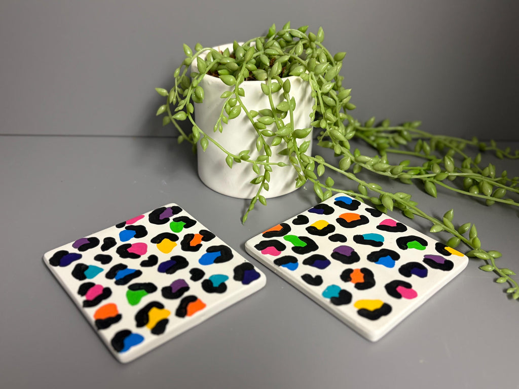 Bright rainbow leopard print hand painted ceramic coasters.