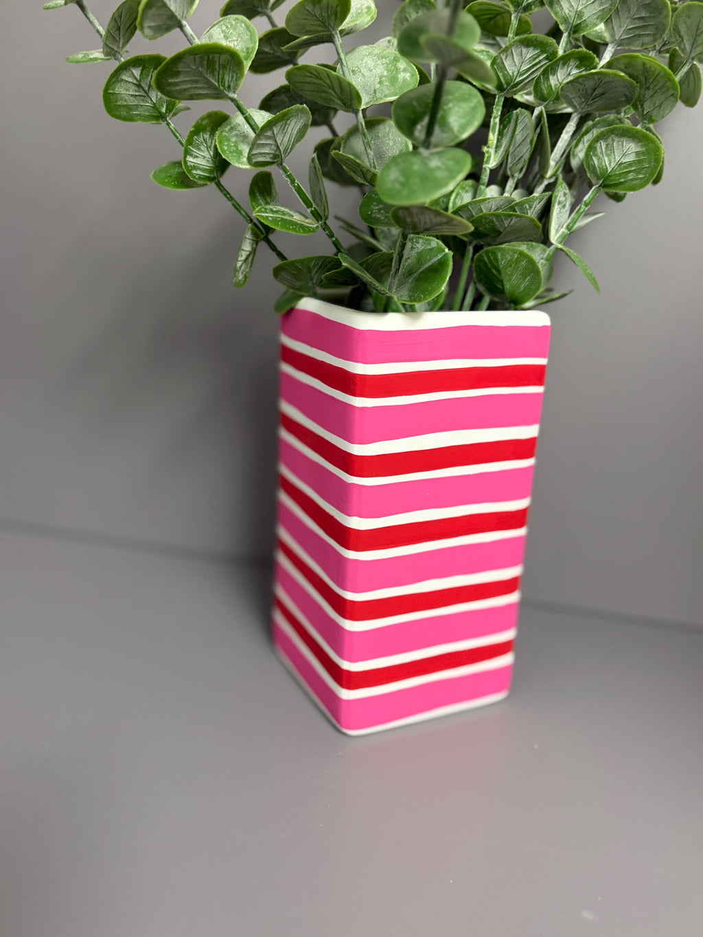 Pink and red stripe hand painted  ceramic vase.