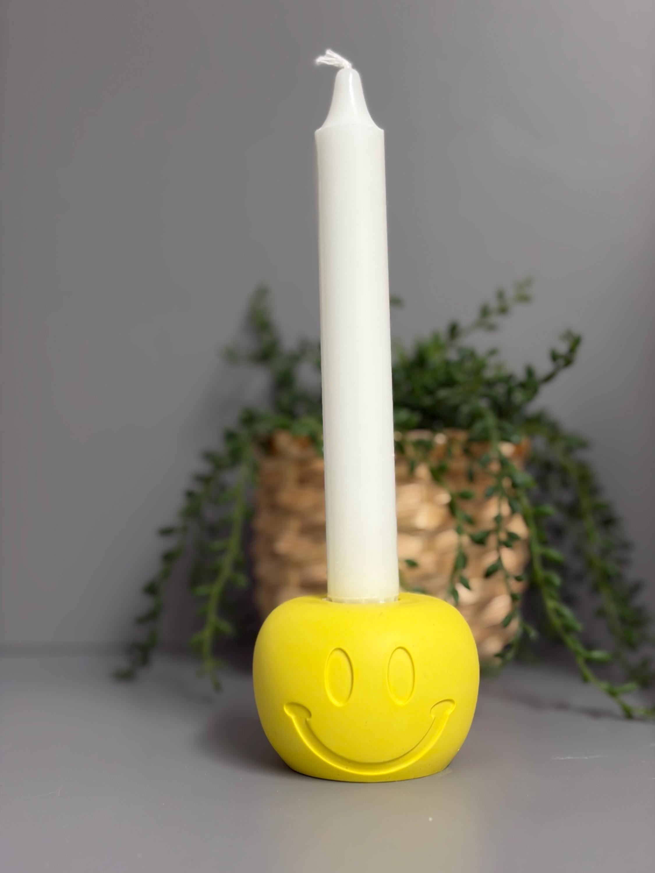 Handmade Jesmonite Smiley Face candle holder.