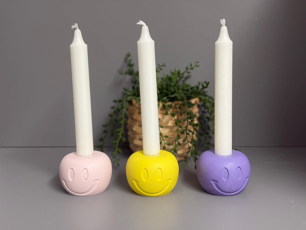 Handmade Jesmonite Smiley Face candle holder.