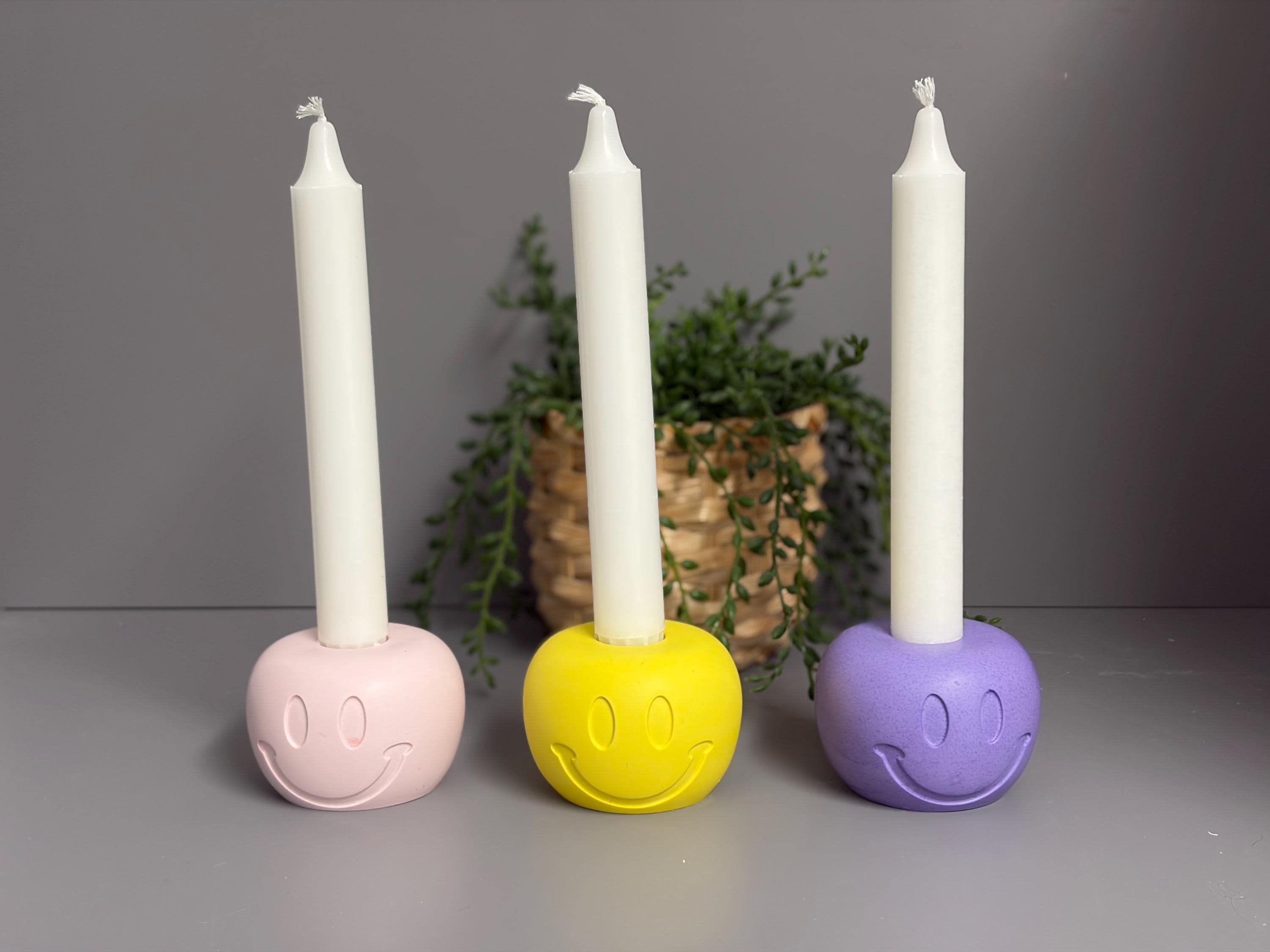 Handmade Jesmonite Smiley Face candle holder.