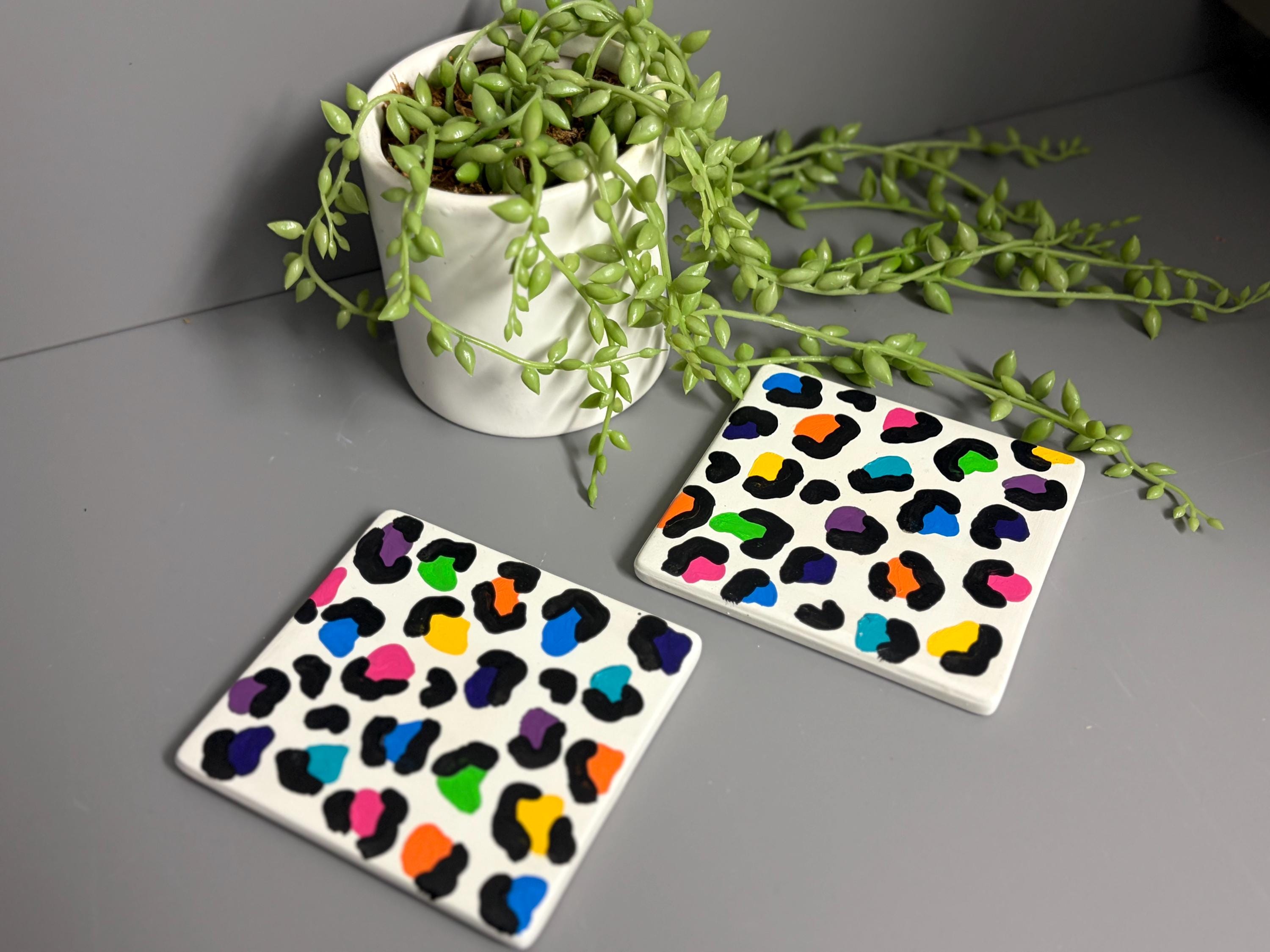 Bright rainbow leopard print hand painted ceramic coasters.
