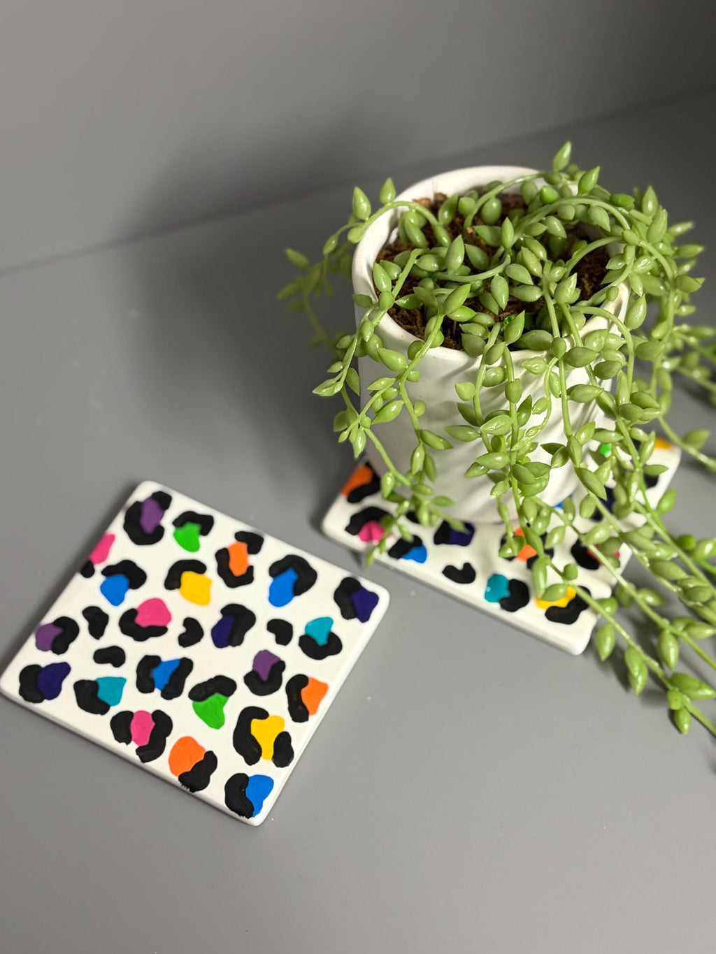 Bright rainbow leopard print hand painted ceramic coasters.