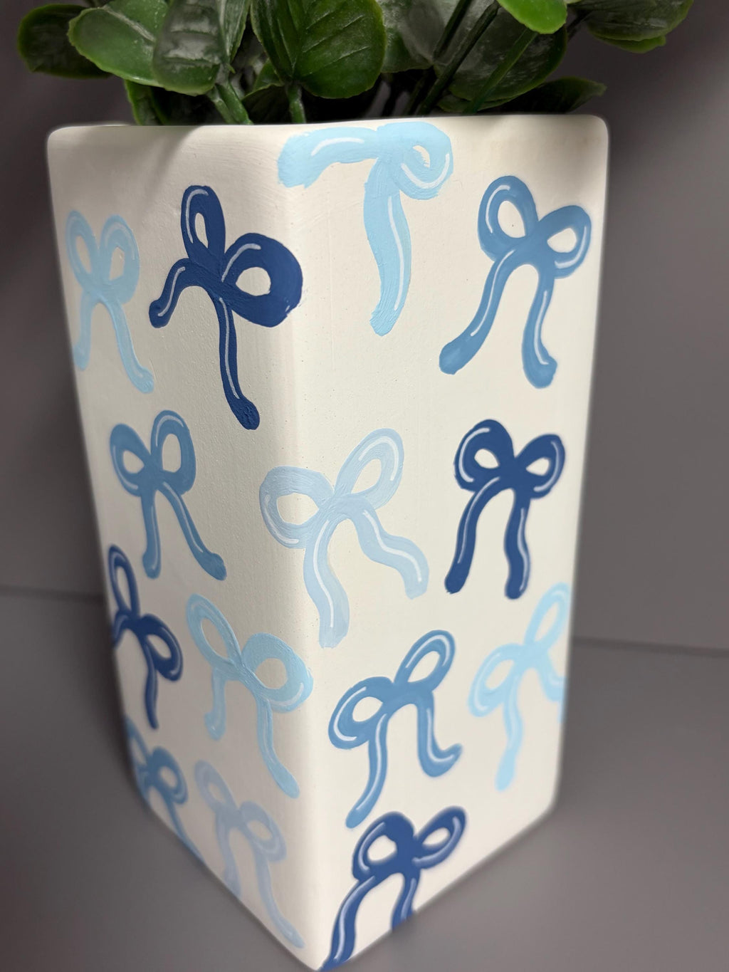 Shades of blue bows hand painted ceramic vase