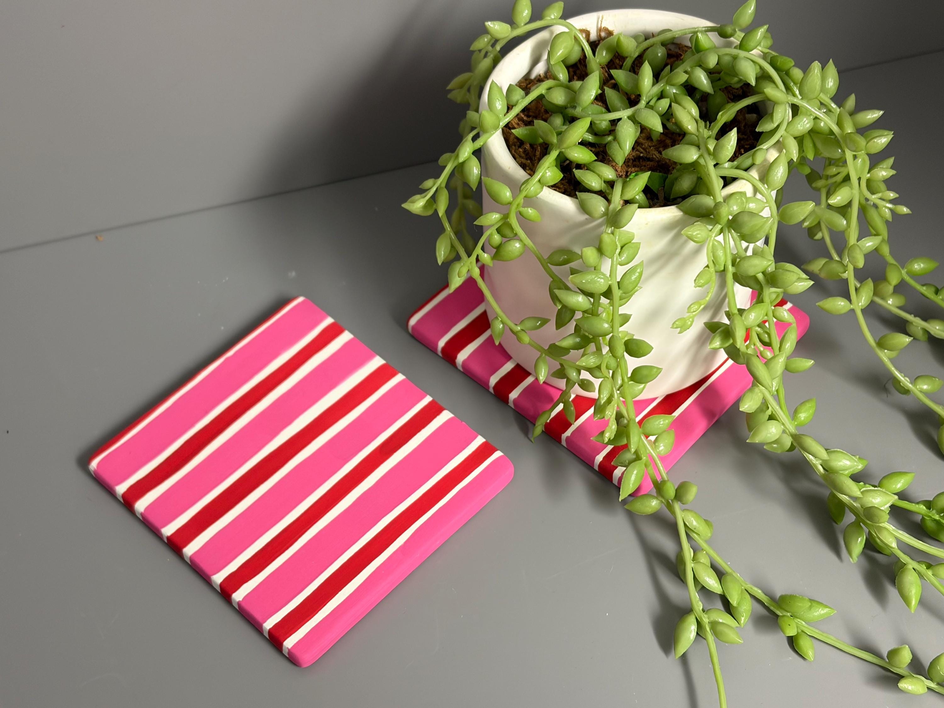 Pink and red stripe hand painted ceramic coasters.