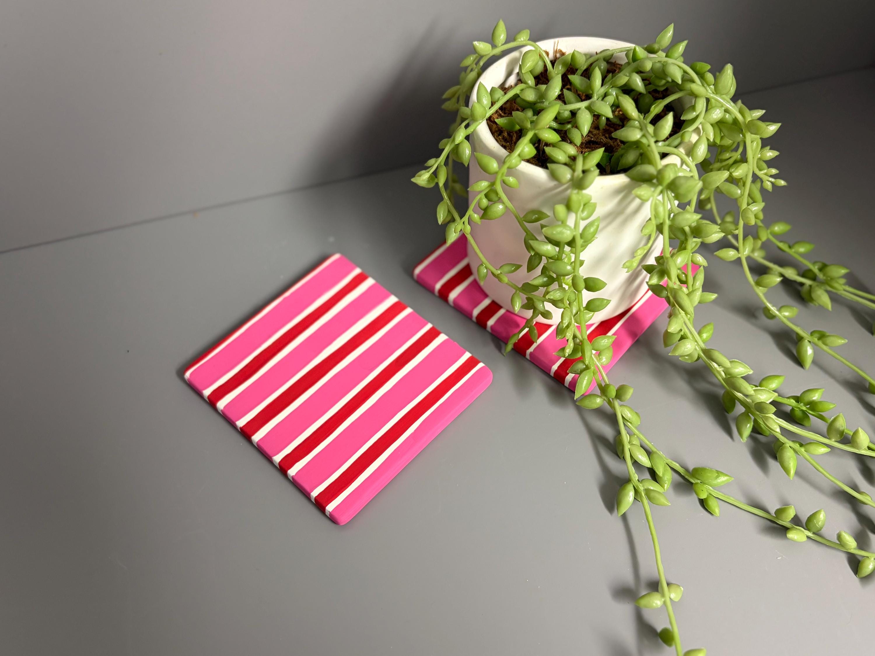 Pink and red stripe hand painted ceramic coasters.