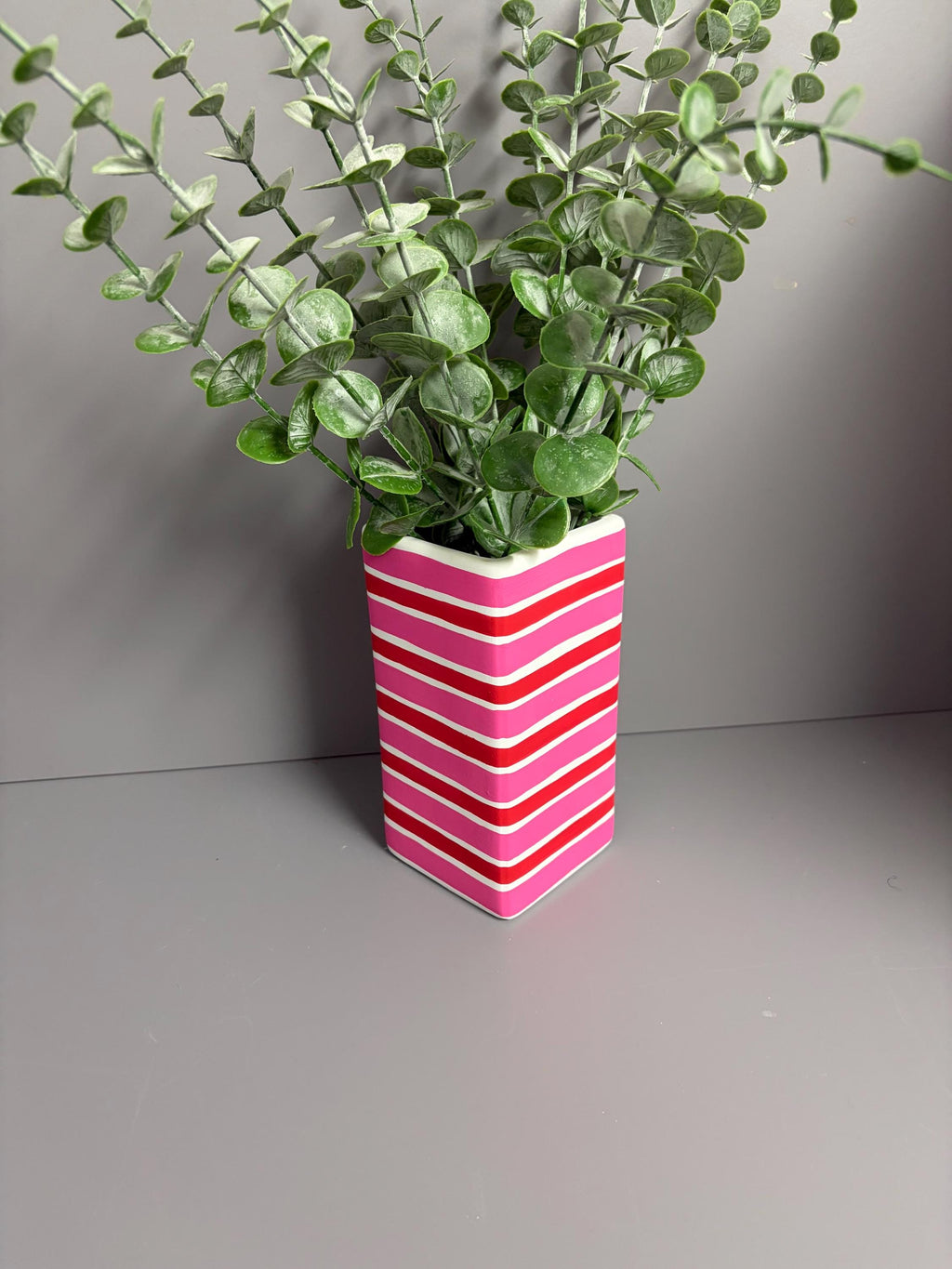 Pink and red stripe hand painted  ceramic vase.